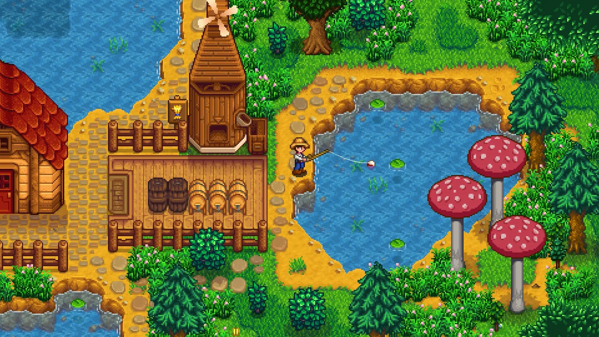 Stardew Valley pixel art farm with the player fishing at a pond beside a mill, sheds and giant red mushrooms